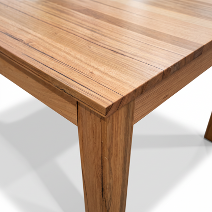 Direct Furniture Depot Velo 2.1m dining table in natural Messmate hardwood showing detailed wood grain and corner leg