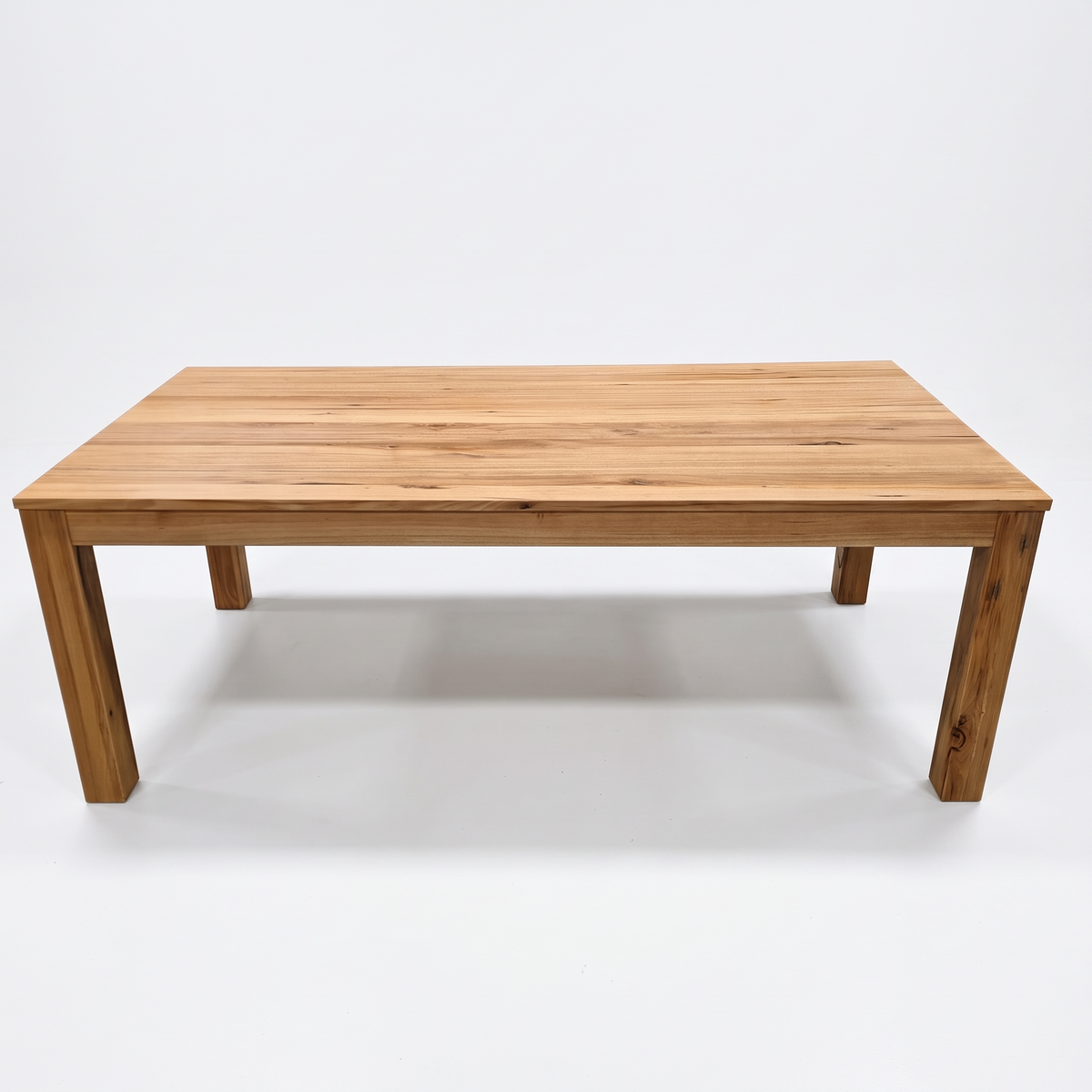 Direct Furniture Depot Velo 2.1m dining table in solid Messmate hardwood with natural grain and warm timber finish.