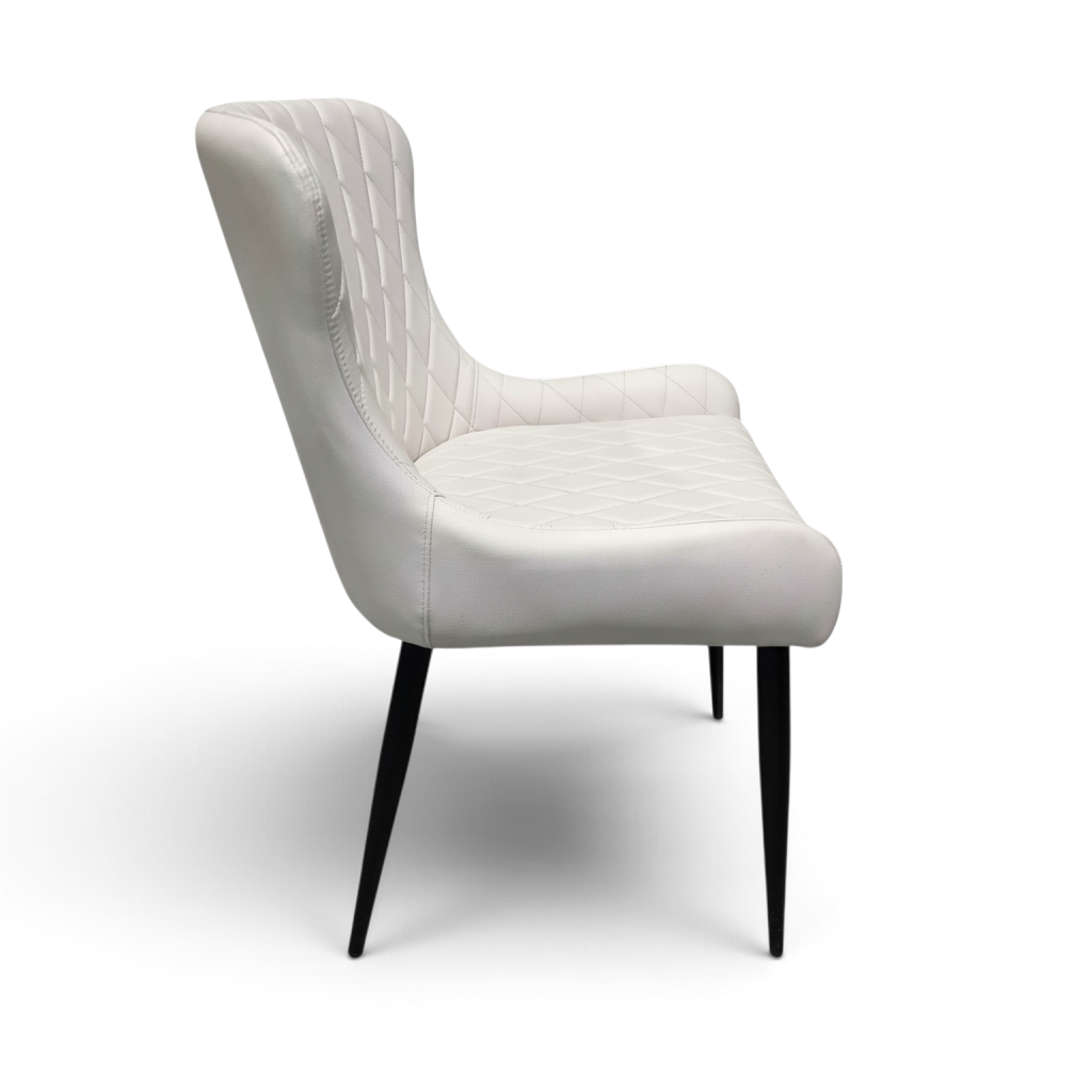 Direct Furniture Depot Miami white dining chair with diamond-pattern stitching and slim black metal legs, side view